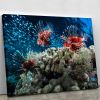 Three Lion fishes and school of bait fish Canvas Print or Poster